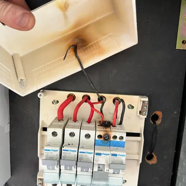 Heat-damaged safety switch removed from a switchboard