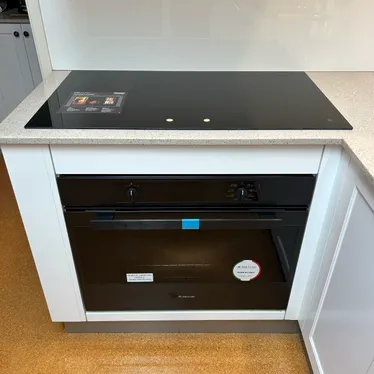New cooktop and under-bench oven installed in a kitchen