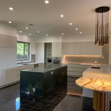 Kitchen with LED downlights and a pendant light fitted by Fused Electrical Co