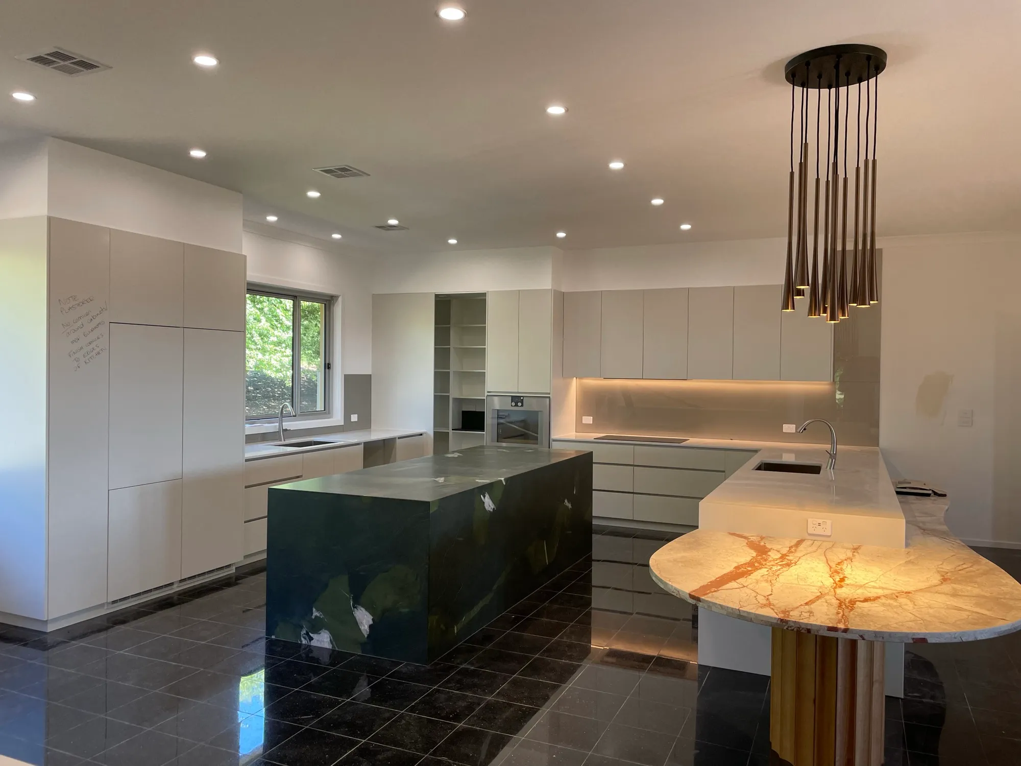 Kitchen with LED downlights and a pendant light fitted by Fused Electrical Co